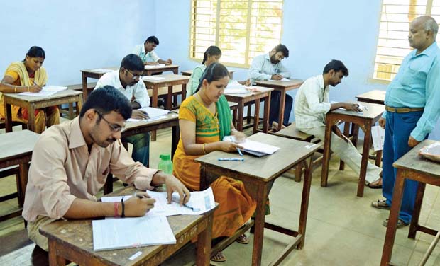 Candidates writing assistant statistical investigator exam in Government Arts College, Coimbatore on Saturday. (Photo: DC) Candidates writing assistant statistical investigator exam in Government Arts College, Coimbatore on Saturday. (Photo: DC)